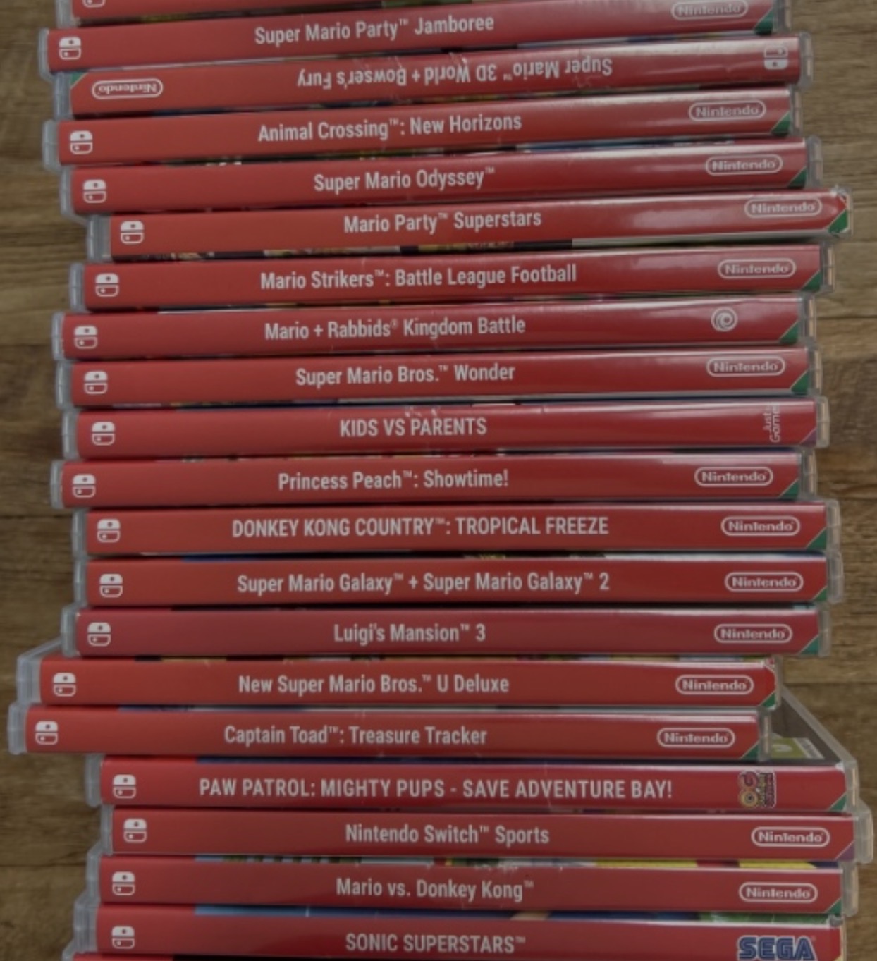 A stack of Nintendo Switch game cases including Super Mario Odyssey, Super Mario Bros. Wonder, and Princess Peach Showtime